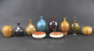 An assortment of studio pottery vases.