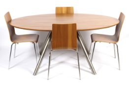 A Habitat Oval shaped retro table and four chairs.