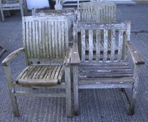 Four slatted wooden garden chairs.