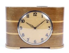 An Art Deco wooden cased mantle clock.