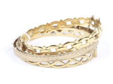 A collection of three 9ct rolled gold bangles. 32.