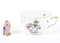 A Herend porcelain figure of an owl and teacup.