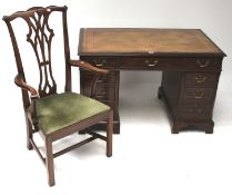 An Edwardian style mahogany twin pedestal desk and chair.