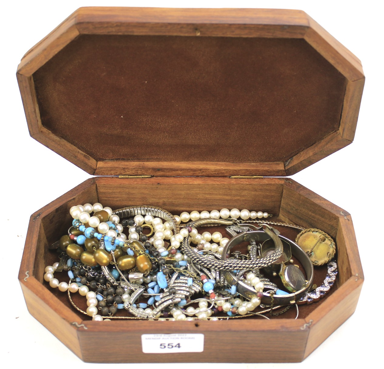 Assorted costume jewellery in a wooden jewellery box.