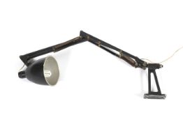 A mid-century Anglepoise style wall mounting lamp.