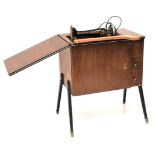 A 1960s century Singer sewing machine and stand.