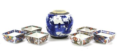 A Chinese blue and white ginger jar and six rice dishes.