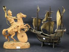 A 20th century gilt metal Marley horse table lamp and a model of a boat.