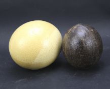A 19th century ostrich egg and coconut.