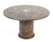 An unusual coffee table inlaid with various fossils, Of circular form,