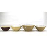 Four contemporary pottery mixing bowls.