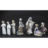 Seven Lladro figures.