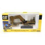 A Cat Excavator with Metal Tracks diecast model. No.