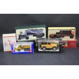 Four boxed diecast vehicles.