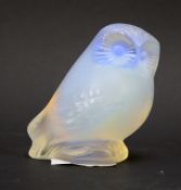 A contemporary Lalique opalescent glass figure of an owl.