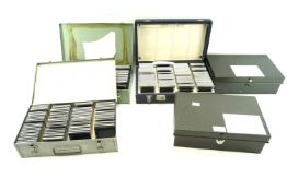 Five metal boxes, three containing family slides from the 1950s/60s.