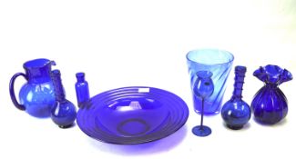 An assortment of blue glass. Including a large ribbed dish, pair of vases, a Diuromil bottle, etc.
