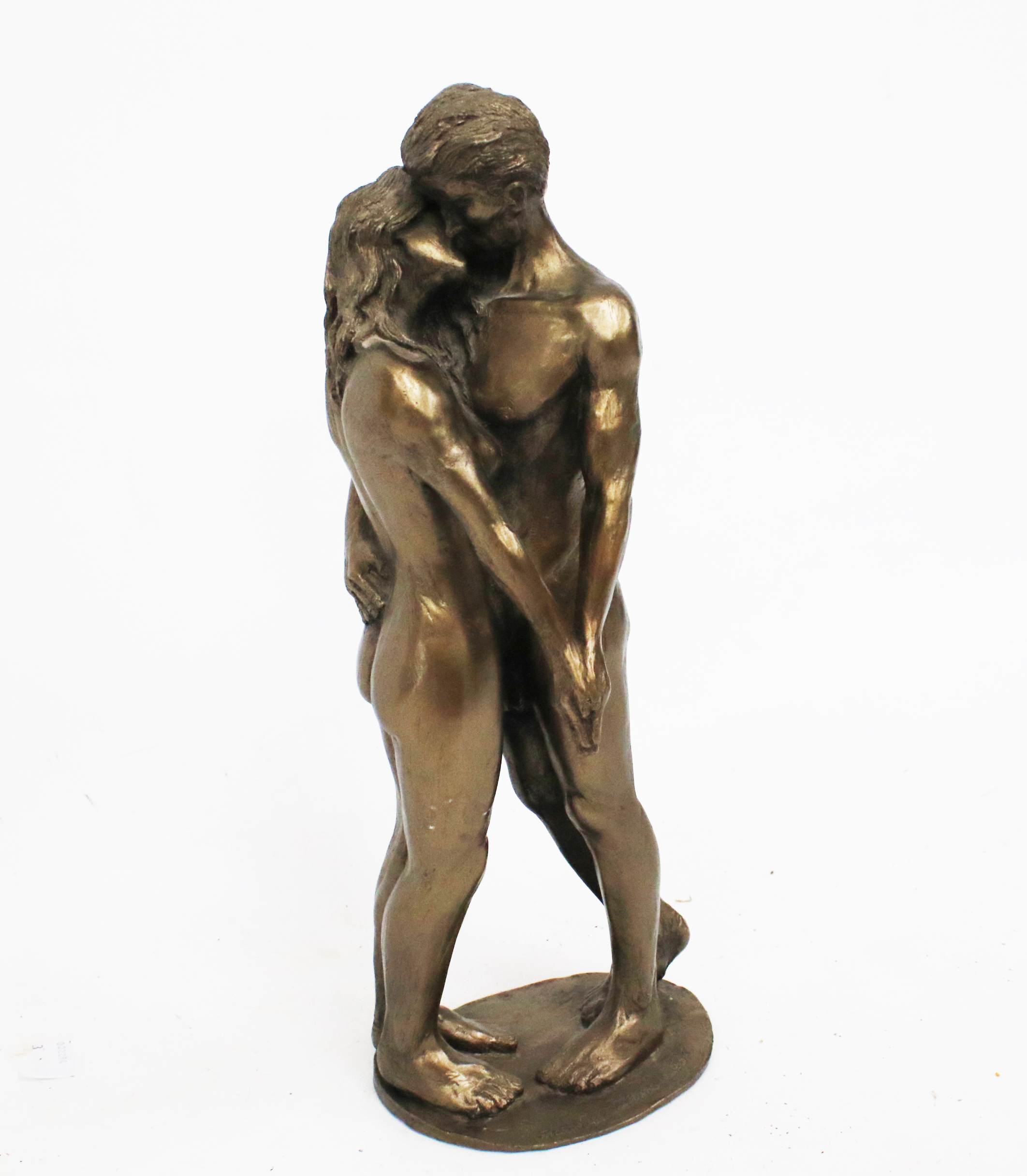 A contemporary bronze effect resin Frith sculpture titled 'The Kiss'.