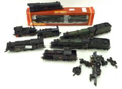 An assortment of OO gauge railway locomotives and related items.