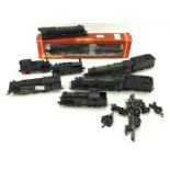 An assortment of OO gauge railway locomotives and related items.