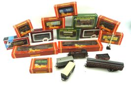 A box of assorted OO gauge railway stock.