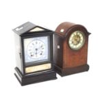 Two early 20th century wooden cased mantle clocks.