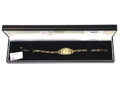 A lady's 9ct gold cased tonneau-shaped bracelet watch.