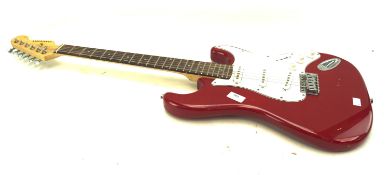 A Chantry electric guitar in red and white and an amplifier G-10.