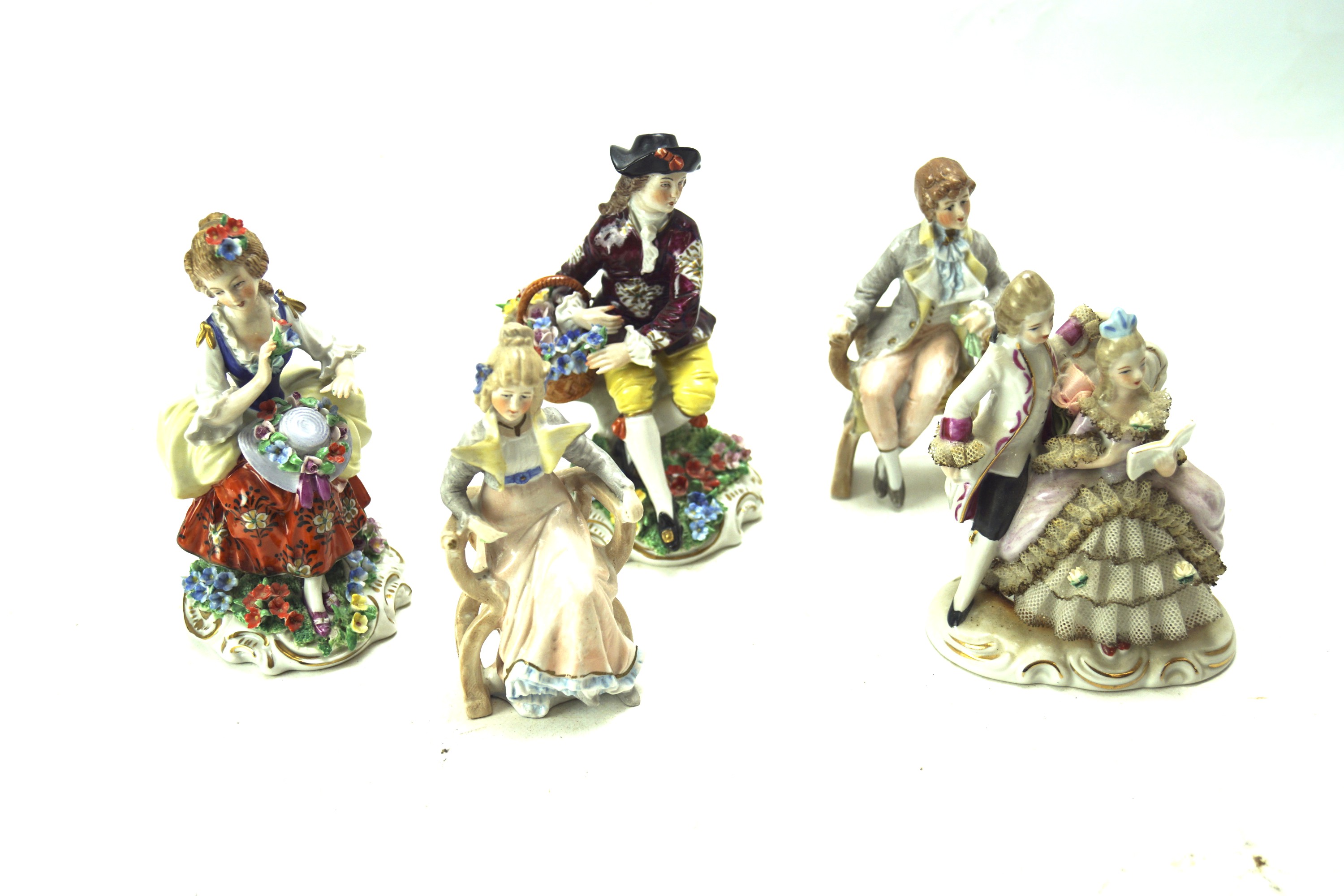 A collection of five continental porcelain figures.