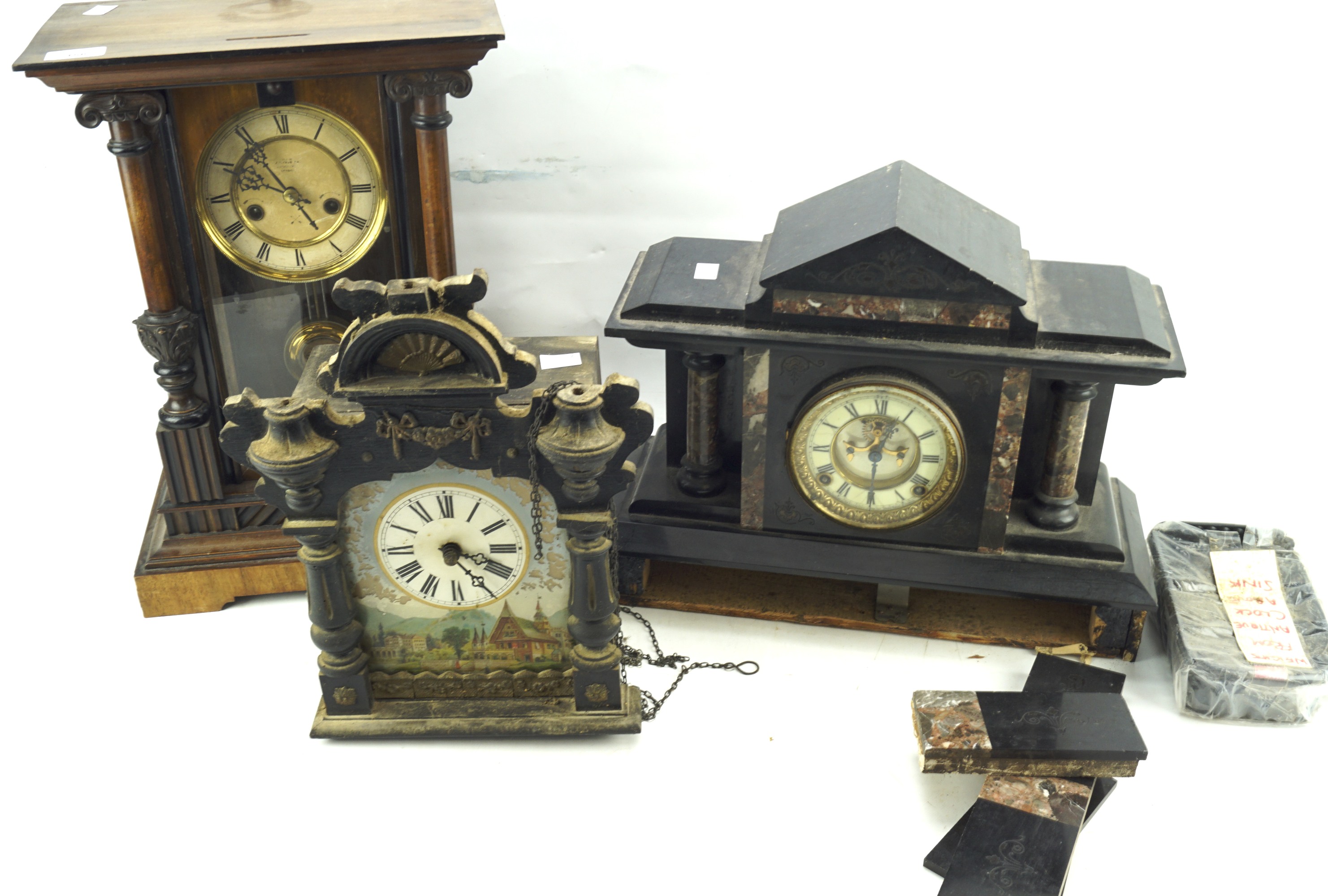 Two wall clocks and slate clock.