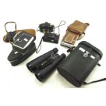 An assortment of cameras and binoculars, To include a Polaroid SX-70 land camera,