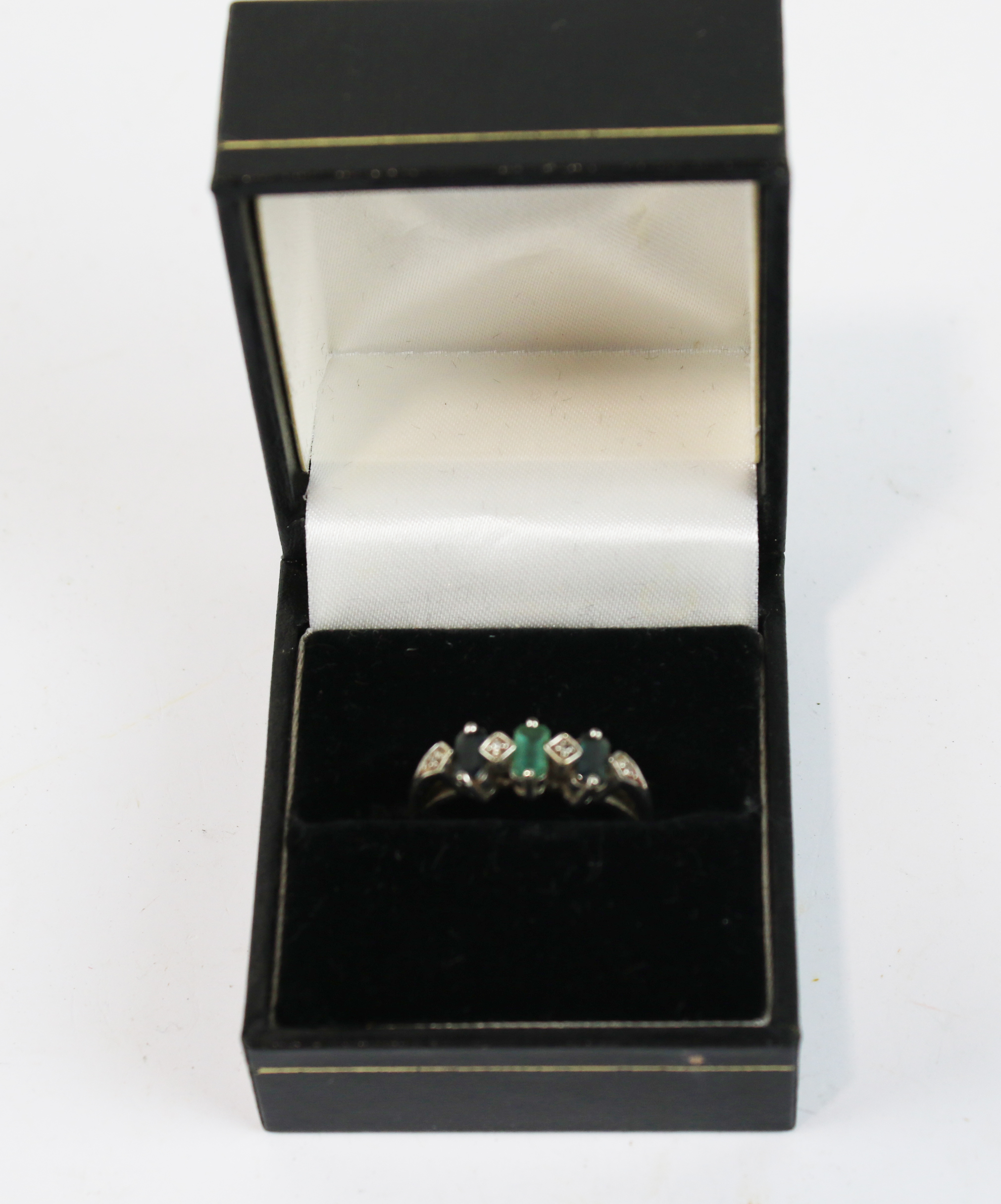 A ladies 9ct white gold gem set dress ring.