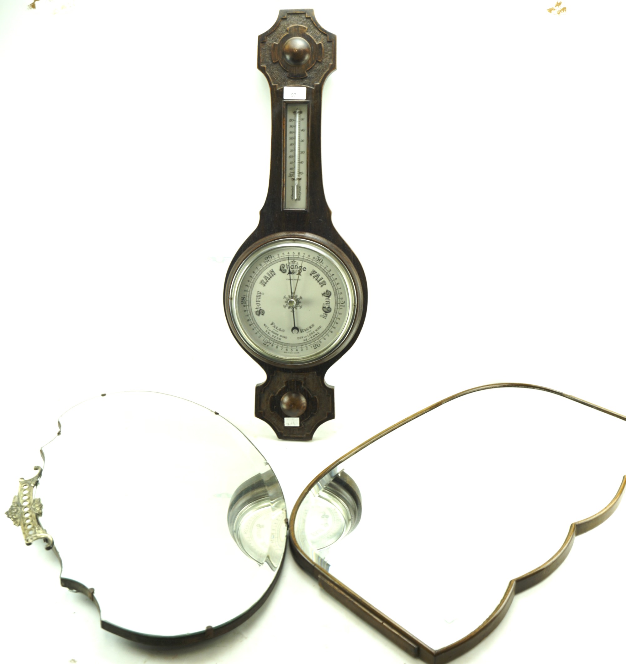 Two wall mirrors and a barometer.