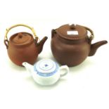 Three Chinese teapots.