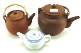 Three Chinese teapots.