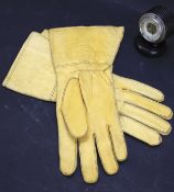A pair of 1942 leather driving gloves and an ebonised barometer.