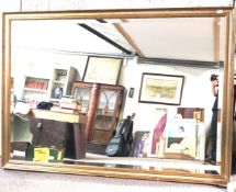 A large gilt framed rectangular bevelled edge wall mirror 197cm x 140cm