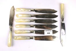 A set of eight mother of pearl handled silver collared set of silver plated fish knives.