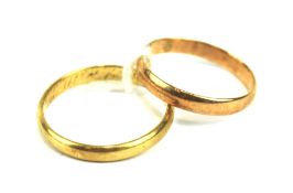 Two yellow metal wedding bands.