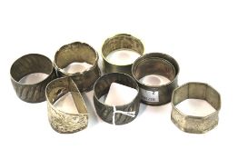 Four silver and four silver plated napkin rings.