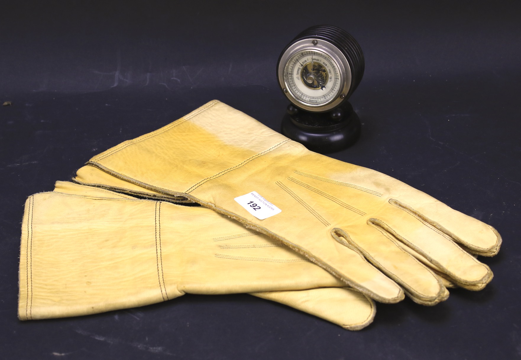 A pair of 1942 leather driving gloves and an ebonised barometer. - Image 2 of 2