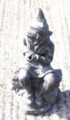 A large heavy metal garden figure depicting an Elf like character Measuring approximately 51cm high