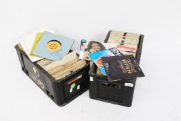 A large collection of vinyl singles, mostly from the 1970s and 80s. In two boxes.