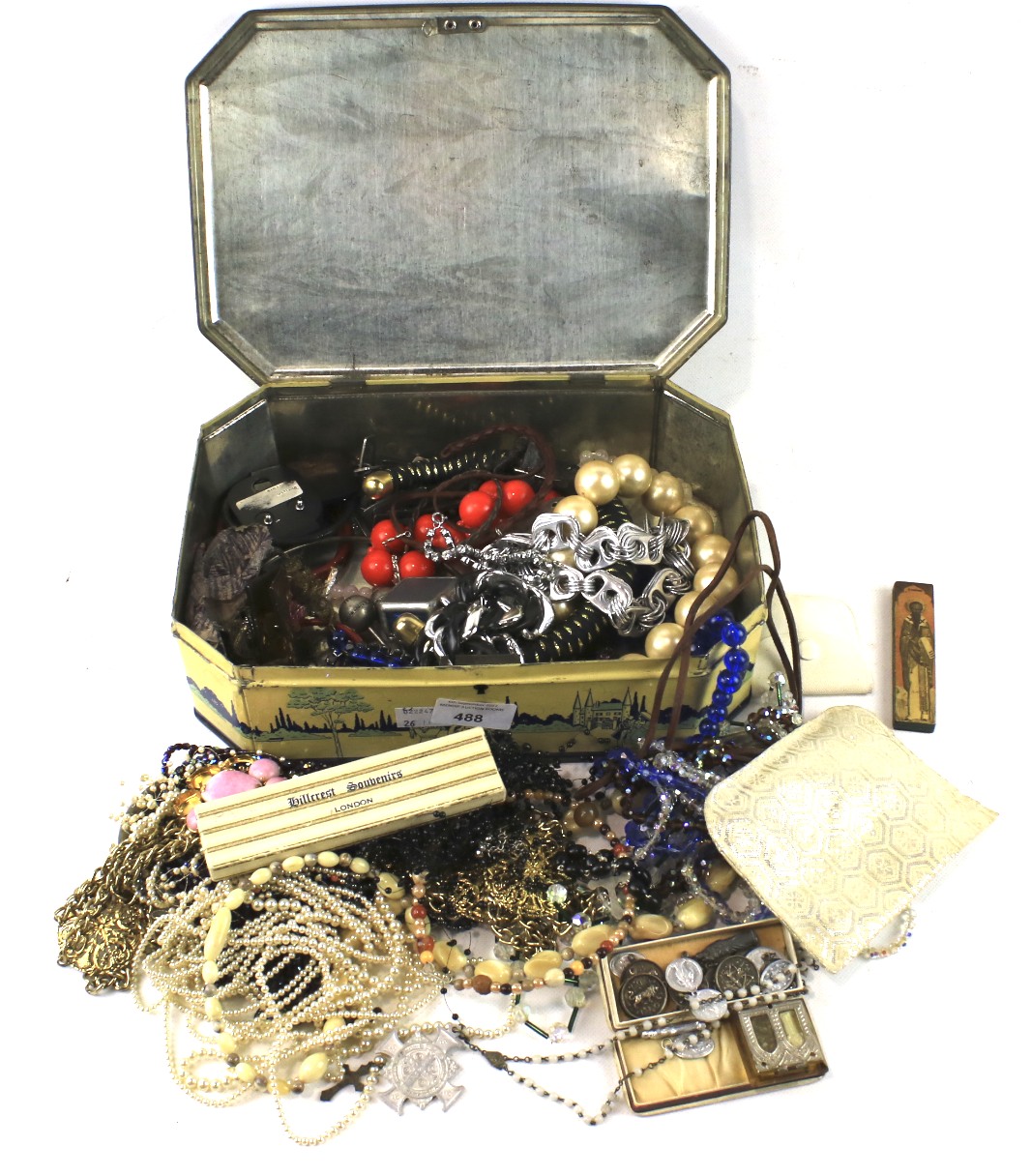 A large assortment costume jewellery and religious items.