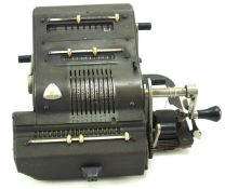 A vintage Brunsviga mechanical calculator.