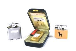 A Dunhill lighter and two Ronson lighters.