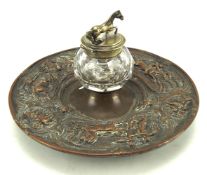 A 19th century Sheffield plate circular inkstand having relief decoration of classical figures