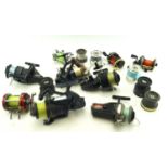 A collection of fishing reels. Including examples by Okuma, Ryobi, Mitchell, D.A.M.