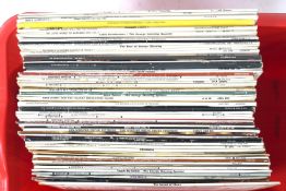 An assortment of classical and Jazz LP's. Various artists and ages approx 62.