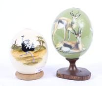 Two painted ostrich eggs.